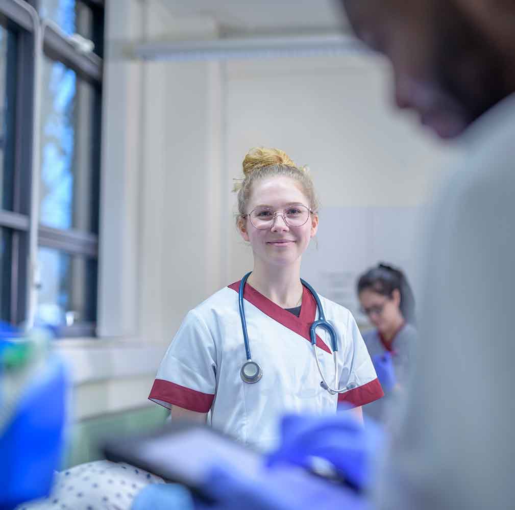 portrait of a smiling nurse on a hospital ward