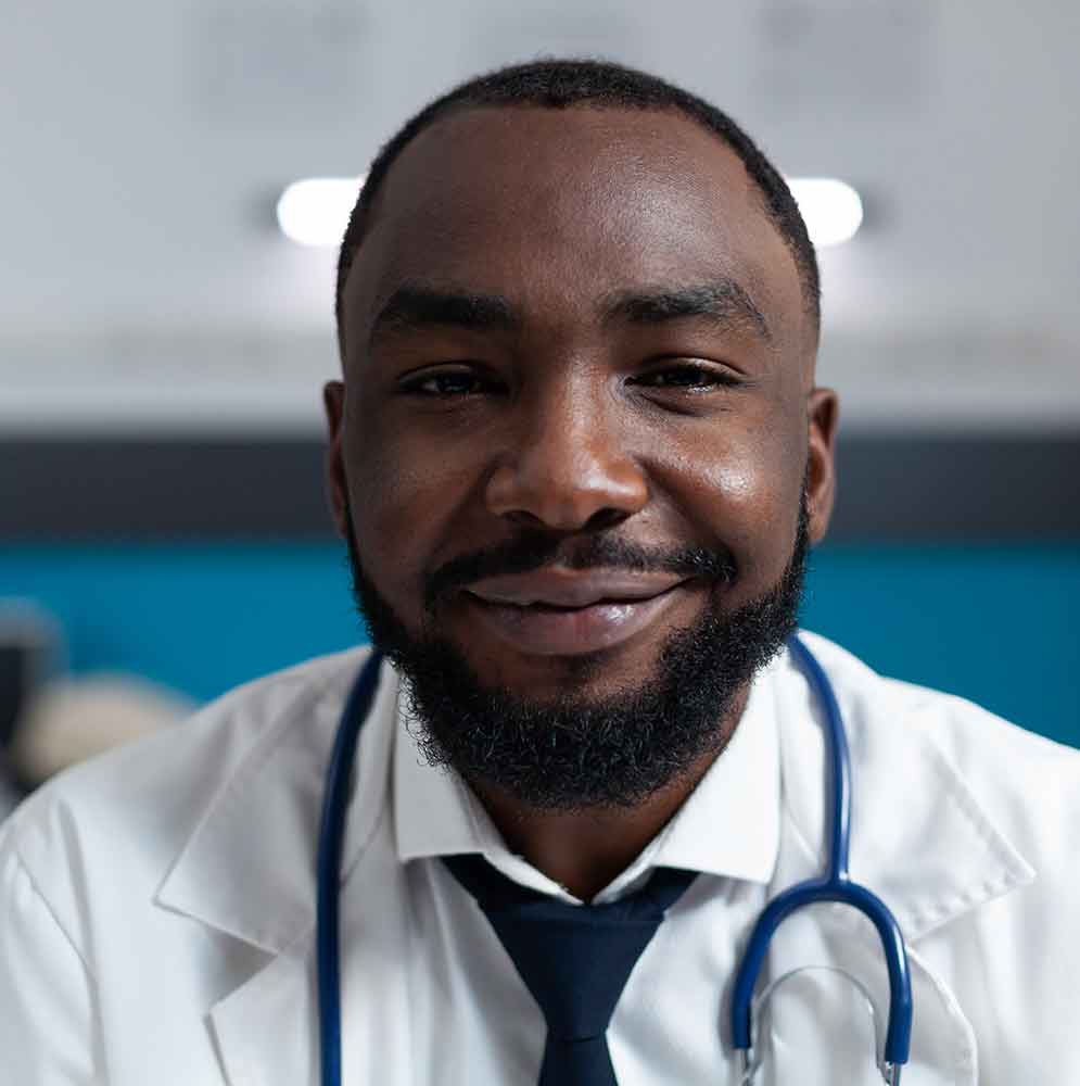 closeup of african american specialist with blue tie and stethescope around neck